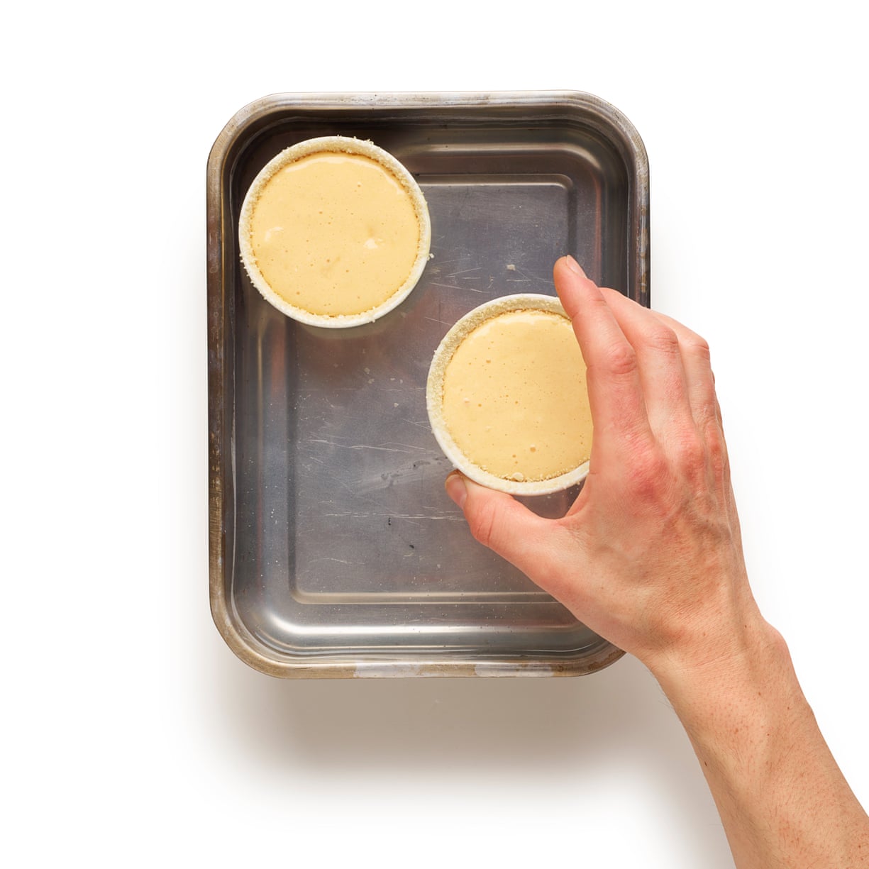 Felicity Cloake Souffle 05: 7 Fill the moulds with souffle mix, put in a bain-marie ( a tray half-filled with water).